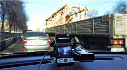 A mini camera sits on a dashboard of a car in Moscow, March 12, 2013