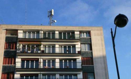 A mobile phone mast on the rooftop of a residential building in Paris, December 10, 2012