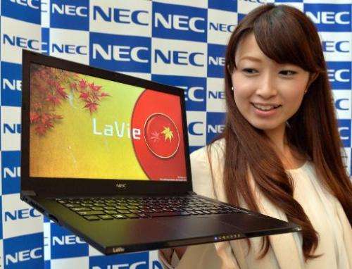 A model in Tokyo on October 15, 2013 displays the world's lightest 13.3-inch sized display notebook computer, NEC's Lavie Z LZ75