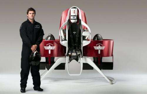 A model stands next to a newly developed personalised jetpack in Christchurch, New Zealand, pictured August, 2013