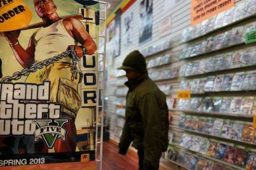 An advertisement for the new Grand Theft Auto is viewed at a gaming store on January 11, 2013 in New York City