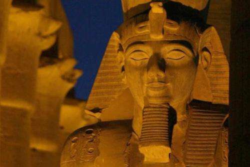 An ancient statue of the Egyptian Pharoah Ramses II adorns the pylon of the Luxor Temple in Luxor, Egypt 14 December 2002
