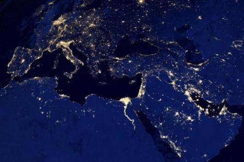 A NASA image obtained December 6, 2012 shows city lights in part of Europe, North Africa and the Middle East at night