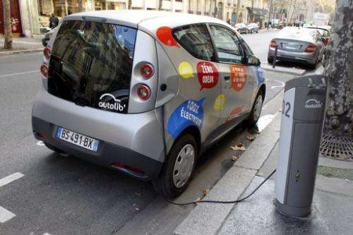 An Autolib electric bluecar plugged at a charging station in Paris on December 2, 2011