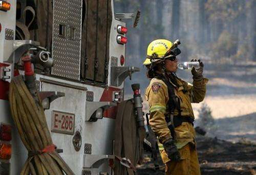 An El Dorado Hills firefighter takes a break from battling the Rim Fire on August 28, 2013 near Groveland, California