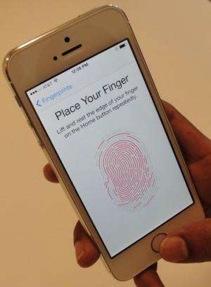 A new iPhone 5S handset, which lets the user unlock the phone with a fingerprint, pictured September 10, 2013