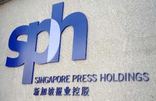 A new Singapore Press Holdings (SPH) logo is unveiled at a ceremony marking the company's 25th anniversary in Singapore on March