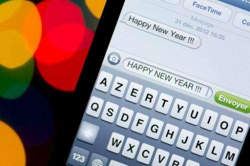 A New Year text message is pictured on a smartphone on December 31, 2012 in Paris