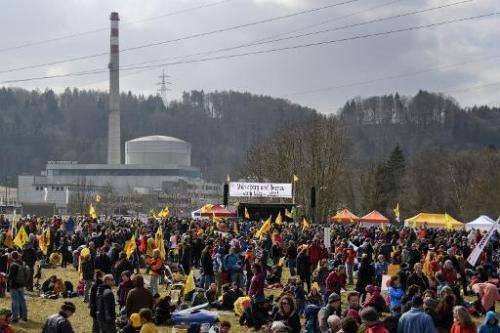 Anti-nuclear activists gather in front of the Muehleberg nuclear plant on March 11, 2012
