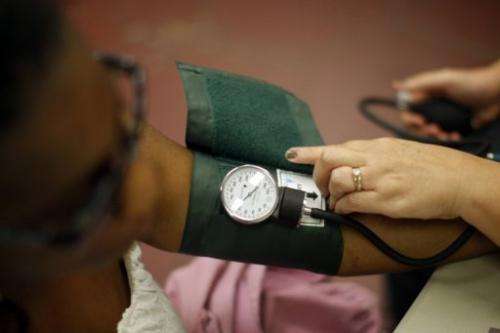 A nurse checks a patient's blood pressure on July 10, 2012 in Los Angeles, California