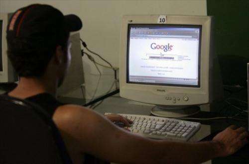An user checks Google at a cybercafe in Brasilia, on April 9, 2008