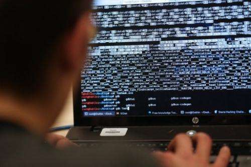 A programmer attends a hacking challenge in Meudon, west of Paris, on March 16, 2013