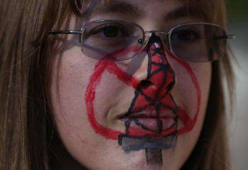 A protestor wears face paint during a demonstration against fracking on July 25, 2012 in Sacramento, California