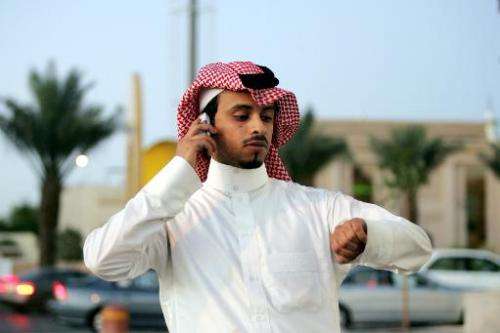 A Saudi man talks on his mobile phone in Riyadh on March 2, 2006