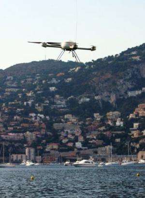 A self or remote-guided drone overflies a beach in Saint-Jean-Cap-Ferrat &amp; Villefranche harbour, France, July 30, 2009