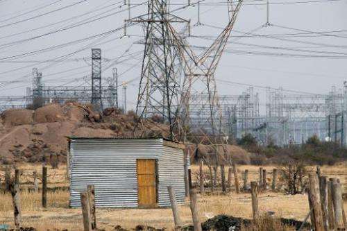 A shack without electricity underneath power lines in Marikana, South Africa, on August 28, 2012