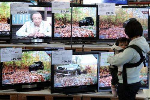 A shopper looks at a display of LCD HDTV televisions on November 18, 2009 in San Francisco, California
