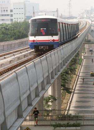 A skytrain, part of Bangkok's first mass transit system, makes its way above city street on October 27, 1998