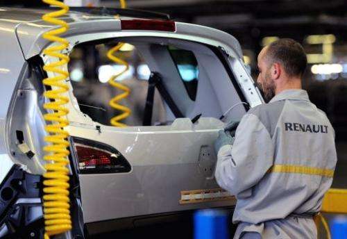 A technician at a Renault plant in the northern city of Douai, works in an assembly line on May 23, 2013