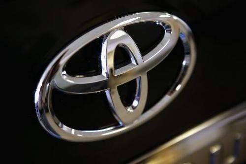 A Toyota logo hangs on a vehicle for sale at Northbrook Toyota on October 2, 2012 in Northbrook, Illinois