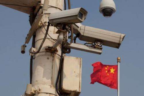 A US panel has raised the specter of sanctions against China, warning Congress that Beijing has not curbed its rampant spying on