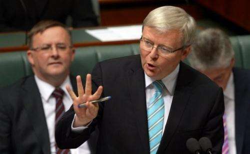 Australian Prime Minister Kevin Rudd (C), pictured in Canberra, on June 27, 2013