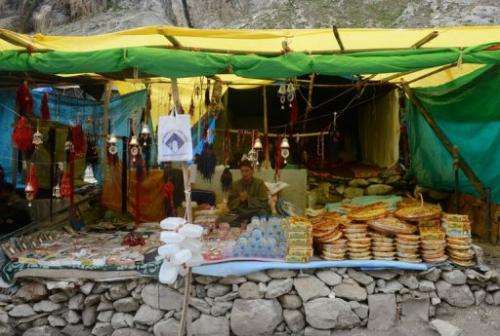 A vendor displays goods for sale at a temporary structure along the track to the Amarnath cave on August 18, 2013