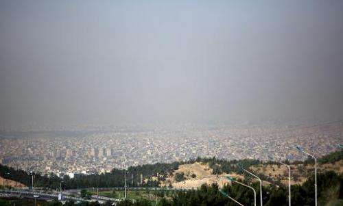 A view of Tehran taken from a vantage point in the east of Tehran shows the metropolitan capital covered in smog on June 26, 201
