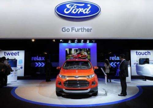 A visitor looks at a Ford B-Max car at the 2013 Mobile World Congress in Barcelona on February 27, 2013