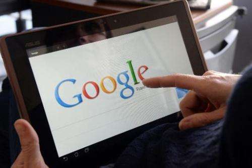 A woman searches the web using Google on May 13, 2013 in Rennes
