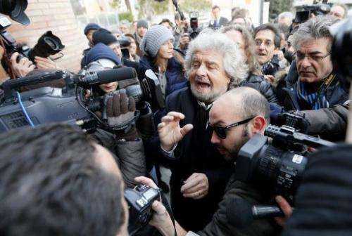 Beppe Grillo is surrounded by journalists, on January 25, 2013, in Siena