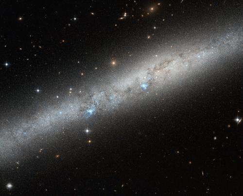 Blue bursts of hot young stars captured by Hubble