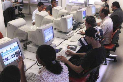 Brazilian Internet users log on at a cybercafe in Sao Paulo, Brazil, on May 26, 2010