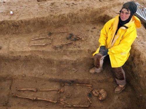 Cecile Paresys stands next to the bones of two Gauls,  on a site in Bucheres, near Troyes, on April 11, 2013
