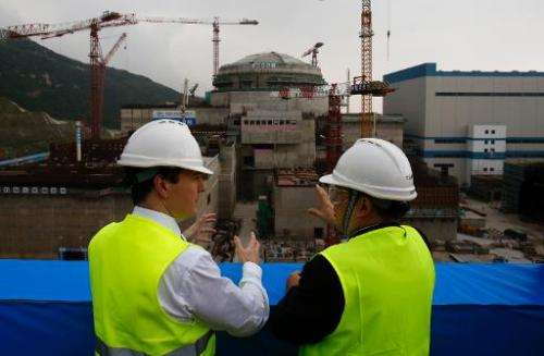 Chancellor George Osborne (left) talks with Taishan Nuclear Power Joint Venture general manager Guo Liming at a nuclear power pl