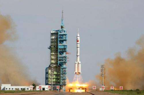 China's Shenzhou-10 rocket blasts off from the Jiuquan space centre in the Gobi Desert, on June 11, 2013