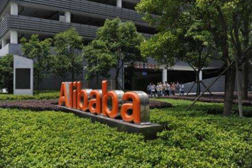 Chinese workers walk out of the Alibaba head office building in Hangzhou, in  China's Zhejiang province on May 21, 2012