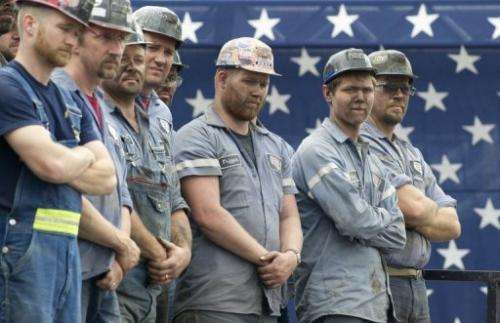 Coal miners listen to Republican candidate Mitt Romney at a campaign event in Beallsville, Ohio, August 14, 2012