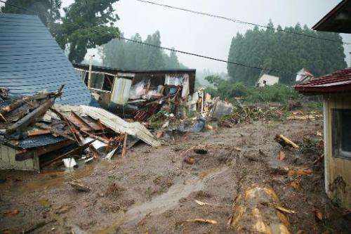 Collapsed houses are seen following floods near Lake Tazawa, in Semboku, Akita prefecture in Japan, on August 10, 2013