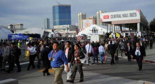 Consumers move between exhibition halls at the 2013 International CES on January 9, 2013 in Las Vegas, Nevada