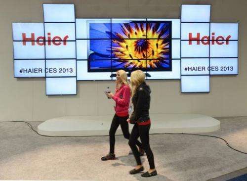 Consumers walk by the Haier booth at CES on January 10, 2013 in Las Vegas, Nevada