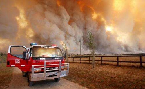 Country Fire Authority (CFA) staff monitor a giant fire raging in the Bunyip State Park, on February 7, 2009