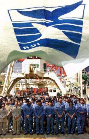 Crew of Japan's whale research vessels at a returning ceremony at Tokyo port on September 21, 2000