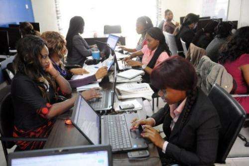Customer care emloyees of the Nigerian job-finder site Jobberman work on June 17, 2013 in the Lagos suburb of Lekki