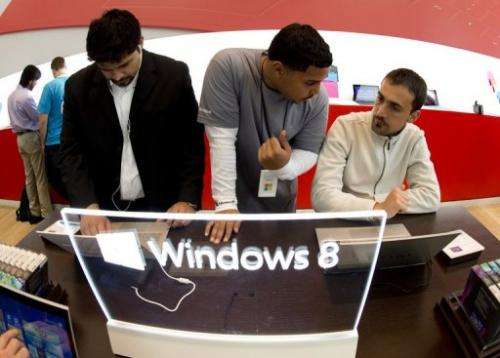 Customers get a look at products at Microsoft's pop-up store on October 26, 2012 in New York
