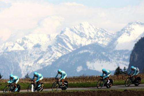 Cyclists ride through mountains in the Giro del Trentino in Lienz on April 16, 2013