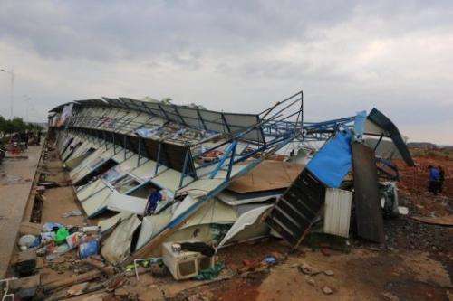Damaged houses are shown after a tornado hit Yongzhou, in central China's Hunan province, March 20, 2013
