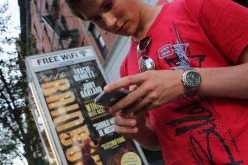 Dutch tourist Bas Derksen surfs the internet at a free Wi-Fi hotspot in Manhattan on July 11, 2012
