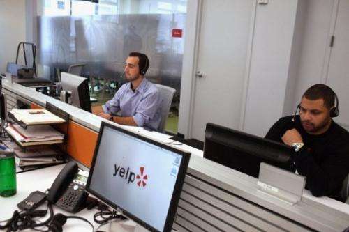 Employees of the online review site Yelp work in New York City on October 26, 2011