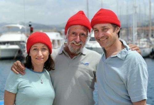 Fabien Cousteau (R) poses with father Jean-Michel and sister Céline on an islet off of Marseille on June 10, 2011